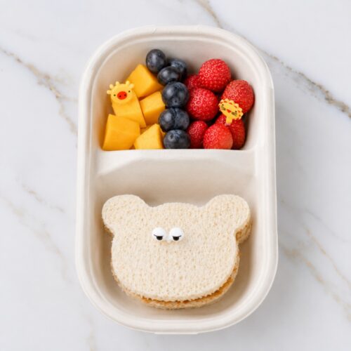 Peanut butter sandwich with cuted fruits